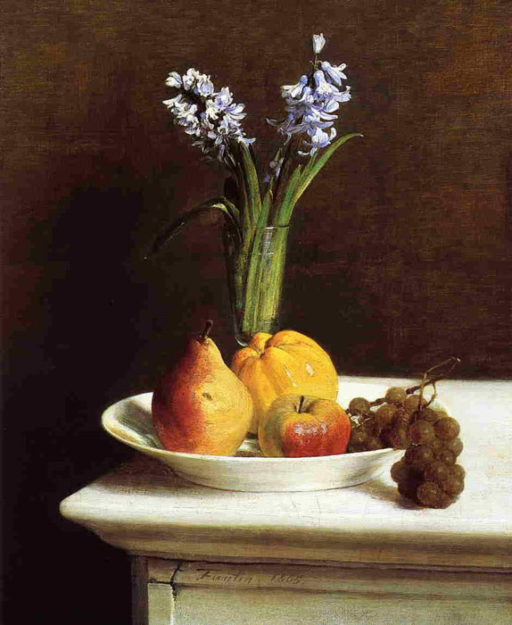flower in glass and fruit in the plate