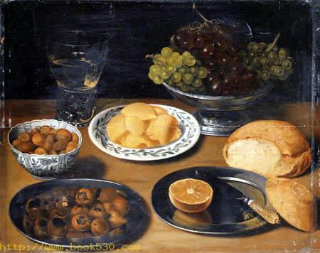 Grapes in a pewter bowl with a bread roll